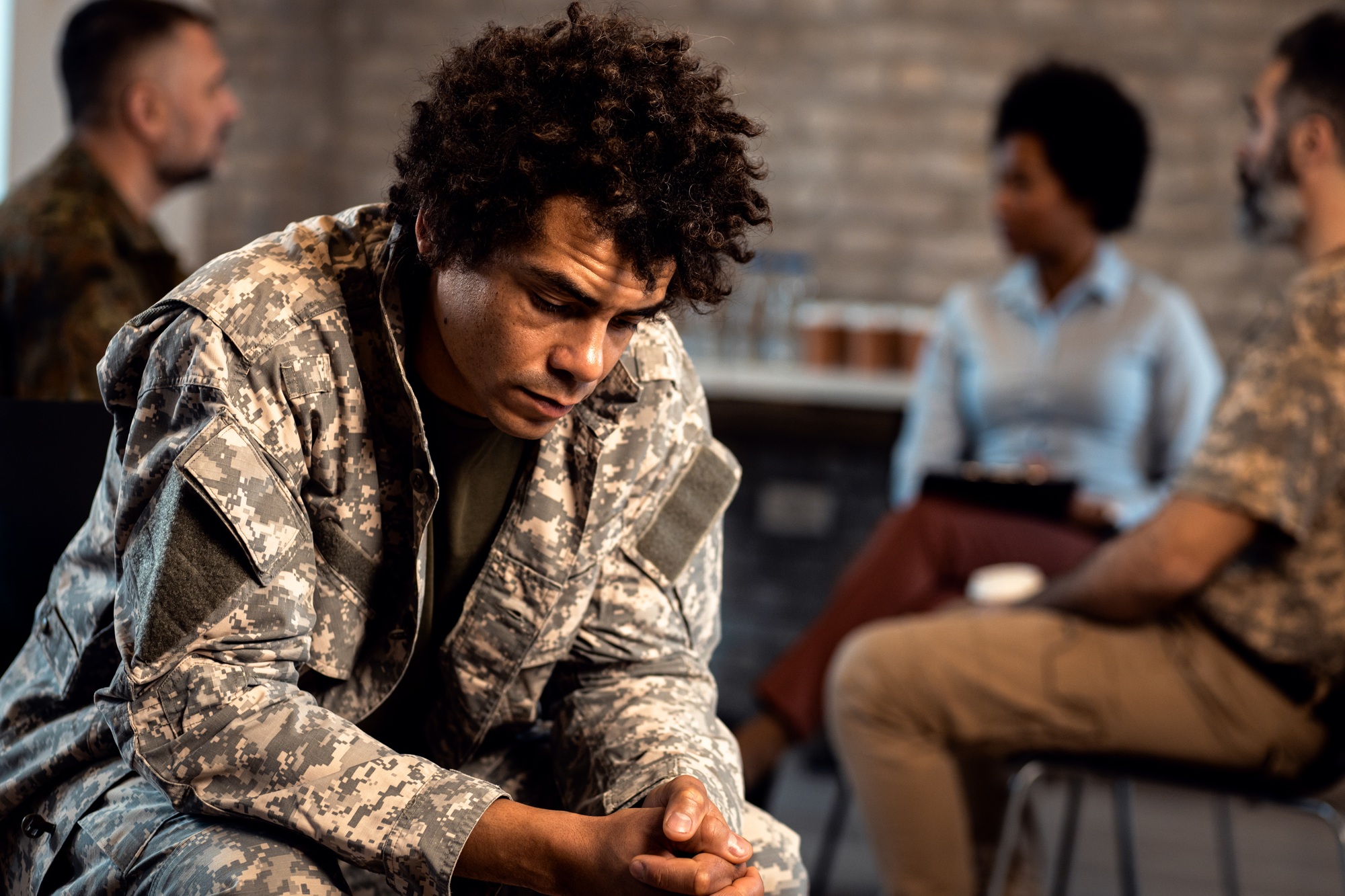 Portrait of African American veteran in PTSD support group.