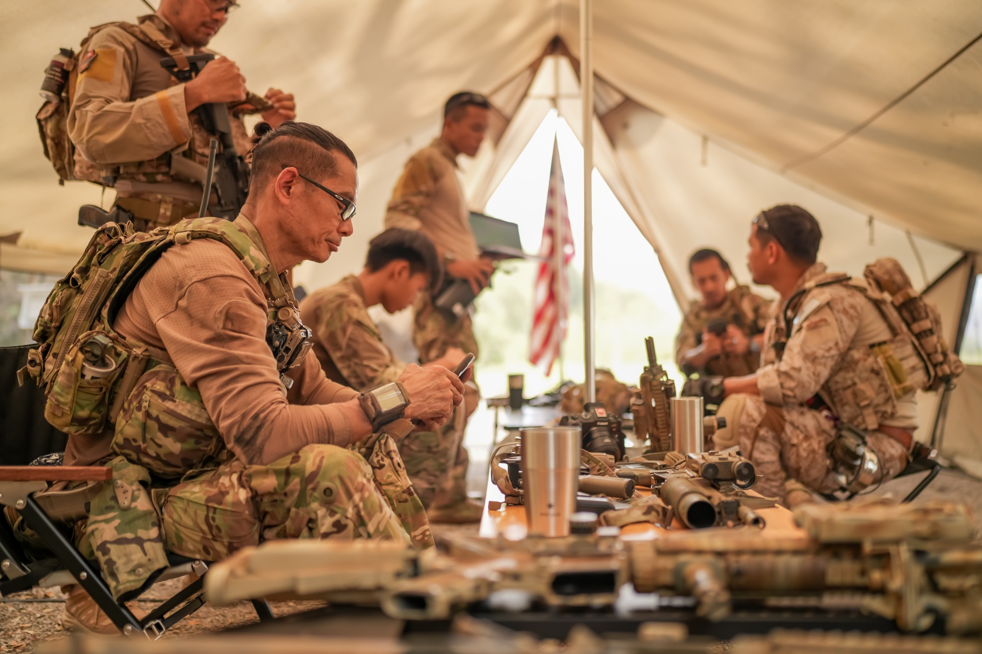 US Army Rangers group with weapons. army , planning strategy or teamwork